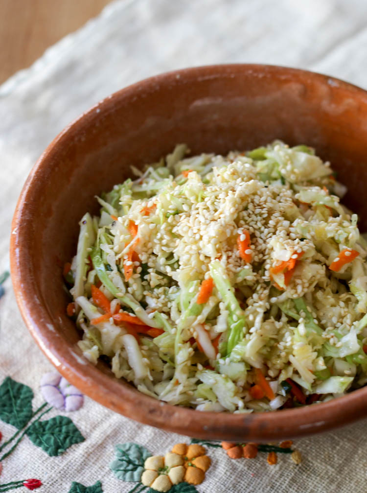 A simple, sweet and sour sesame coleslaw. This no-mayo slaw is similar to the Salt Lick recipe but a little easier to make at home