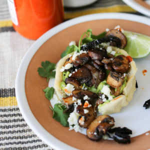 Vegetarian sopes with guacamole, sauteed mushrooms, crisp fried ancho chile strips and cotija cheese. Easily converts to a vegan sopes recipe, too! Sopes are a thick corn tortilla shell filled with anything you like and they make an easy weeknight meal.