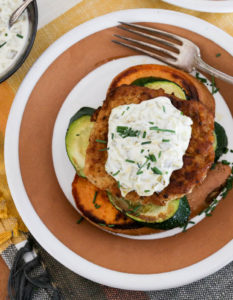 Healthy, low-carb, grain-free turkey burger "stacks" with a layer of fried sweet potato, spiced turkey patty and creamy green chile sauce