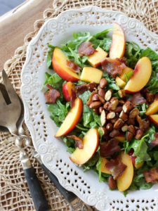 Wonderful main-dish summer salad with fresh peaches or nectarines, crispy bacon, toasted almonds, and arugula in a simple, homemade honey mustard dressing