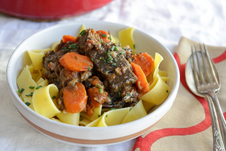 Daube de Boeuf - a dead-simple French beef stew with carrots, mushrooms, cooked down with vermouth and gin. Sounds weird as hell, but your guests will love it 