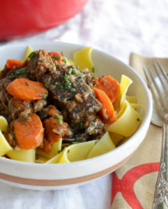 Daube de Boeuf - a dead-simple French beef stew with carrots, mushrooms, cooked down with vermouth and gin. Sounds weird as hell, but your guests will love it