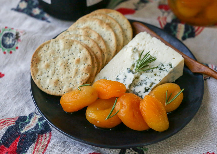 Rosemary-honey marinated dried apricots are a unique, delicious and easy addition to a holiday cheese plate!