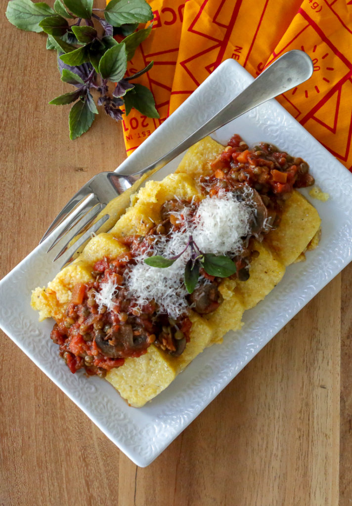 Vegan lentil bolognese sauce with mushrooms - perfect over pasta or polenta for a hearty, healthy vegan main dish. 