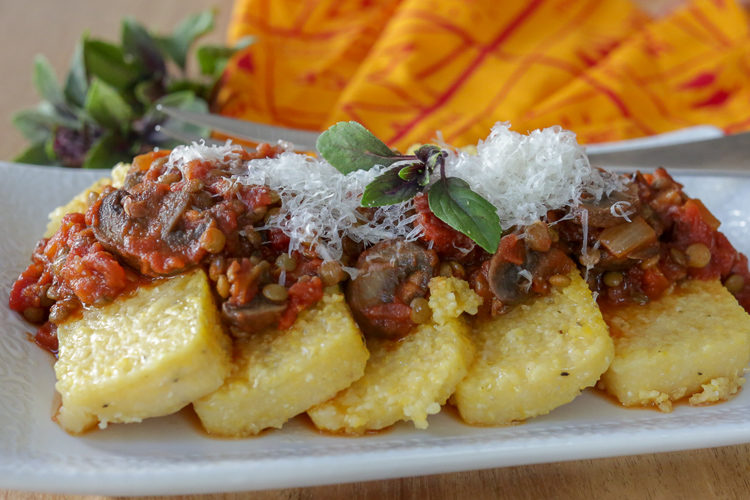 Vegan lentil bolognese sauce with mushrooms - perfect over pasta or polenta for a hearty, healthy vegan main dish. 