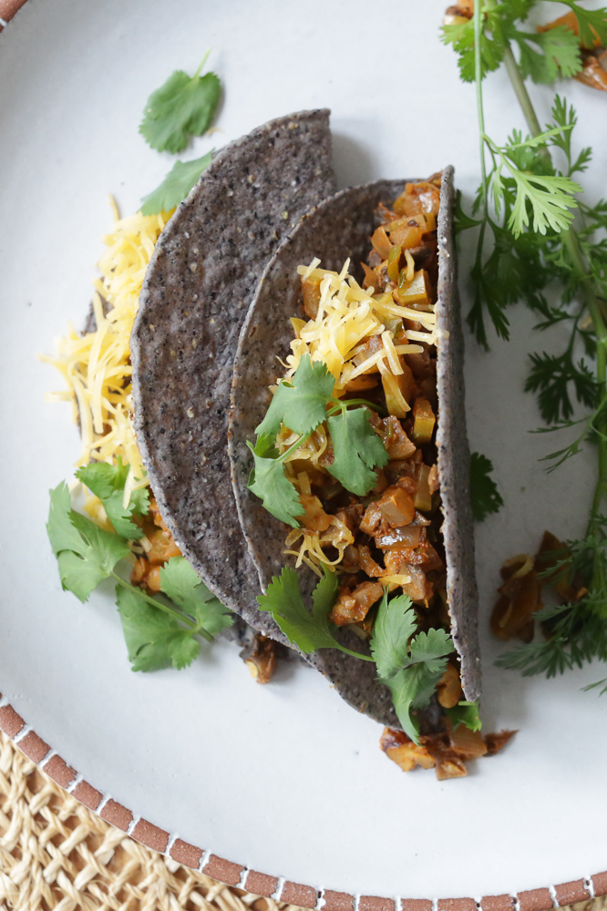 Vegan crispy taco filling with no beans! Mushrooms, vegetables, spices, and some walnuts or pecans for healthy fats and great texture. Serve this vegan picadillo inside crispy taco shells or soft tortillas with your choice of toppings. Also great as a taco salad!