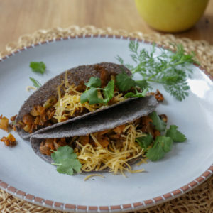 Vegan crispy taco filling with no beans! Mushrooms, vegetables, spices, and some walnuts or pecans for healthy fats and great texture. Serve this vegan picadillo inside crispy taco shells or soft tortillas with your choice of toppings. Also great as a taco salad!