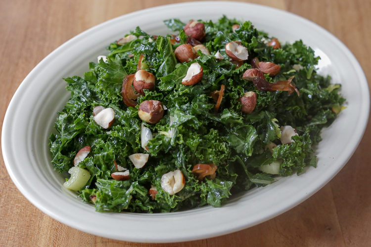 Date and kale salad: massaged kale salad with olive oil, lemon juice, pomegranate molasses, dates, celery, nuts and a bit of hot peppers