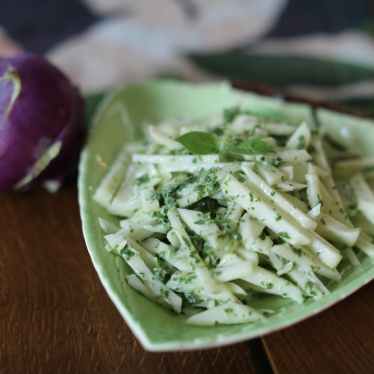 Kohlrabi slaw with herbed green goddess dressing in a green dish