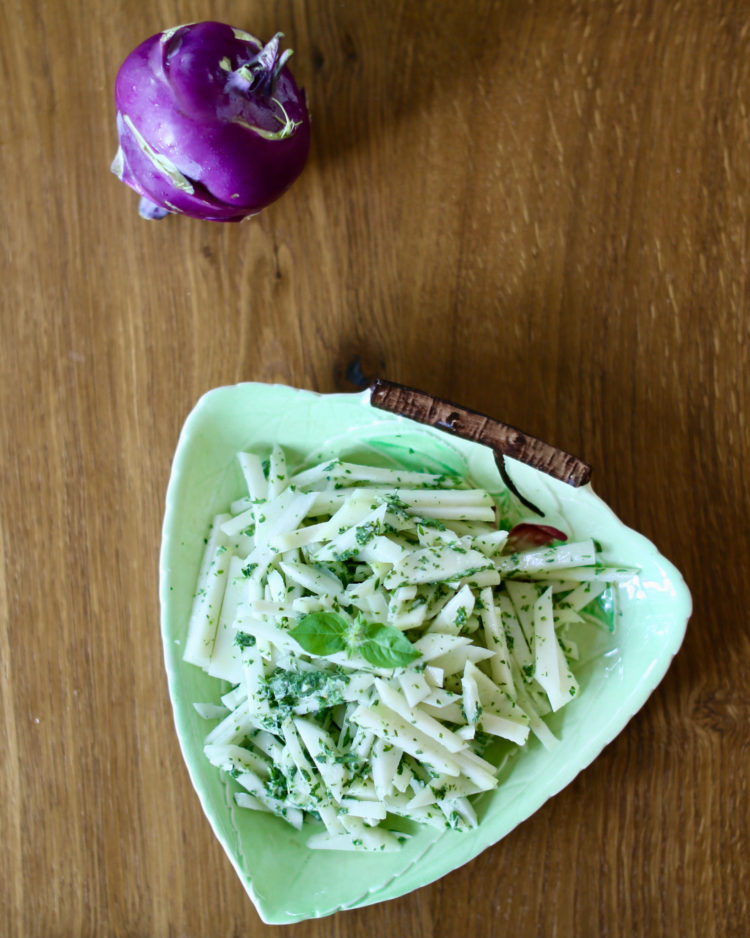 Kohlrabi slaw with herbed green goddess dressing in a green dish